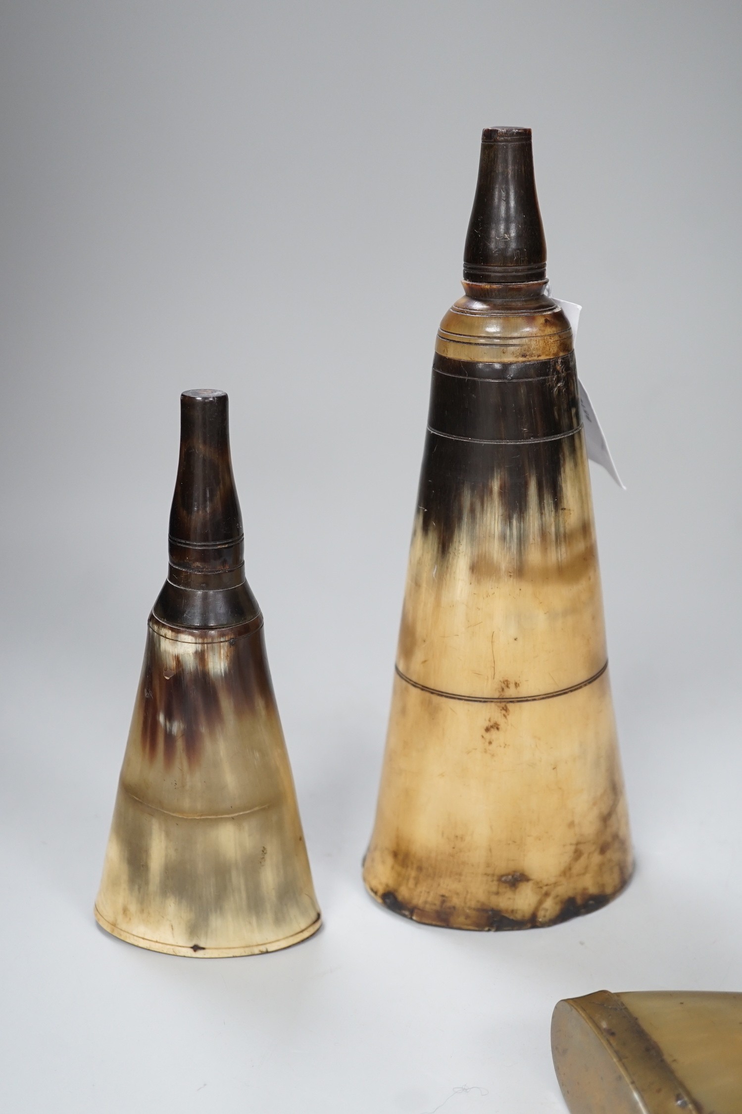 Three various 19th century horn flasks/beakers. Largest 25cm wide